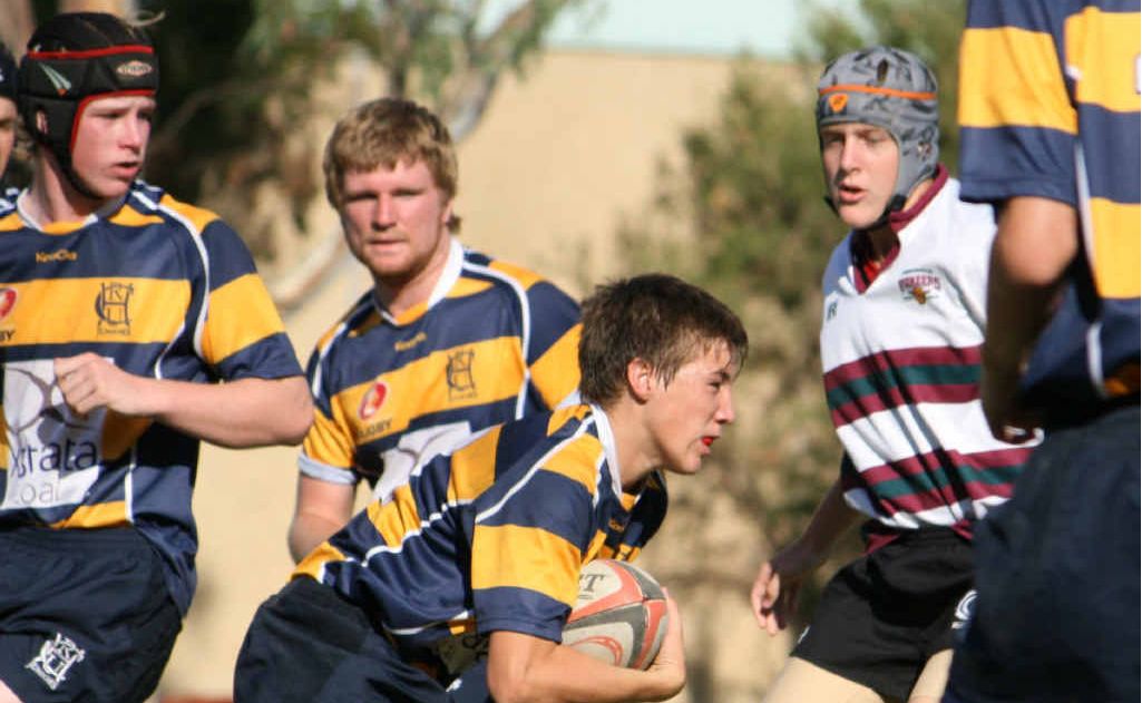 Central Highlands juniors take on the defence. Central Highlands juniors take on the defence.